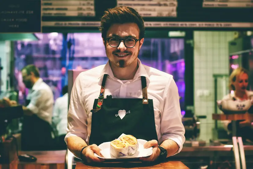 a server holding a burrito