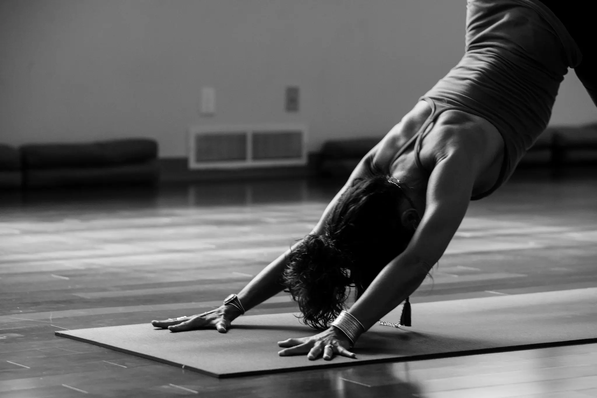 A woman doing downward dog pose