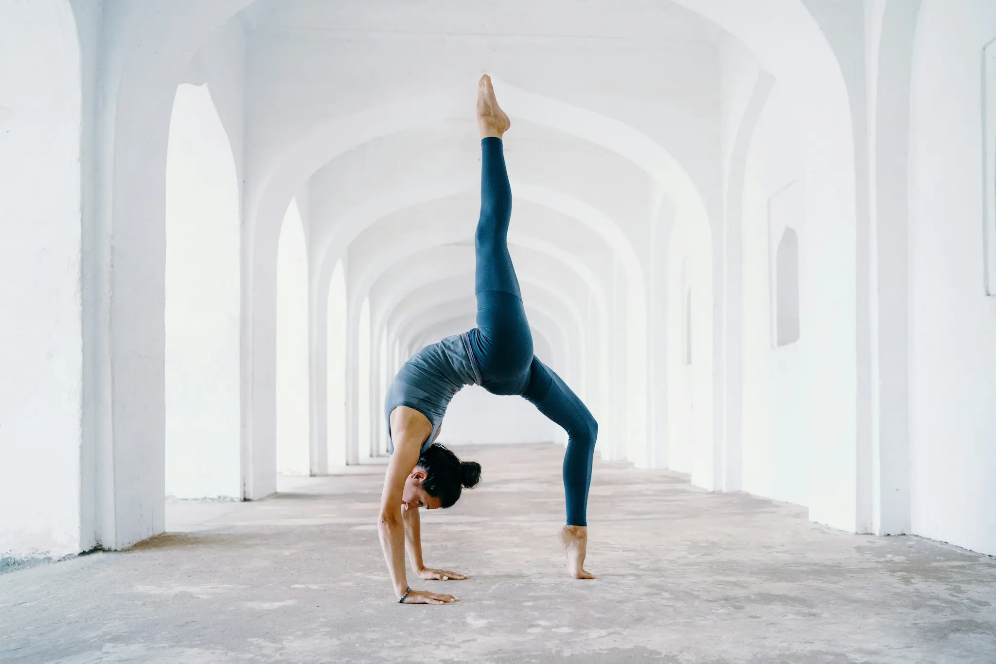 A woman doing downward dog pose